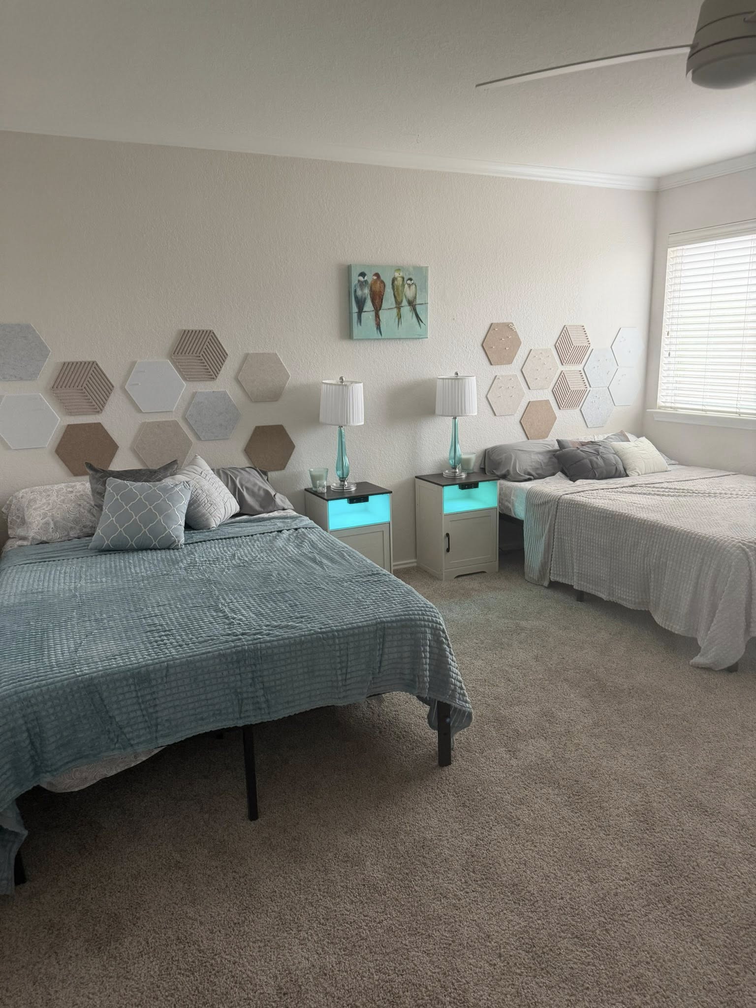 Shared bedroom with full-size beds and calm blue bedding